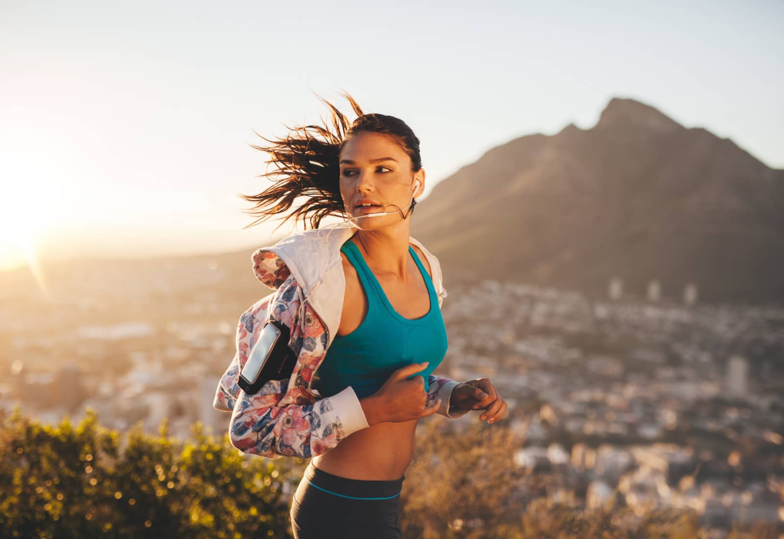 fit young woman running in the mountains, LASIK Fortitude Valley