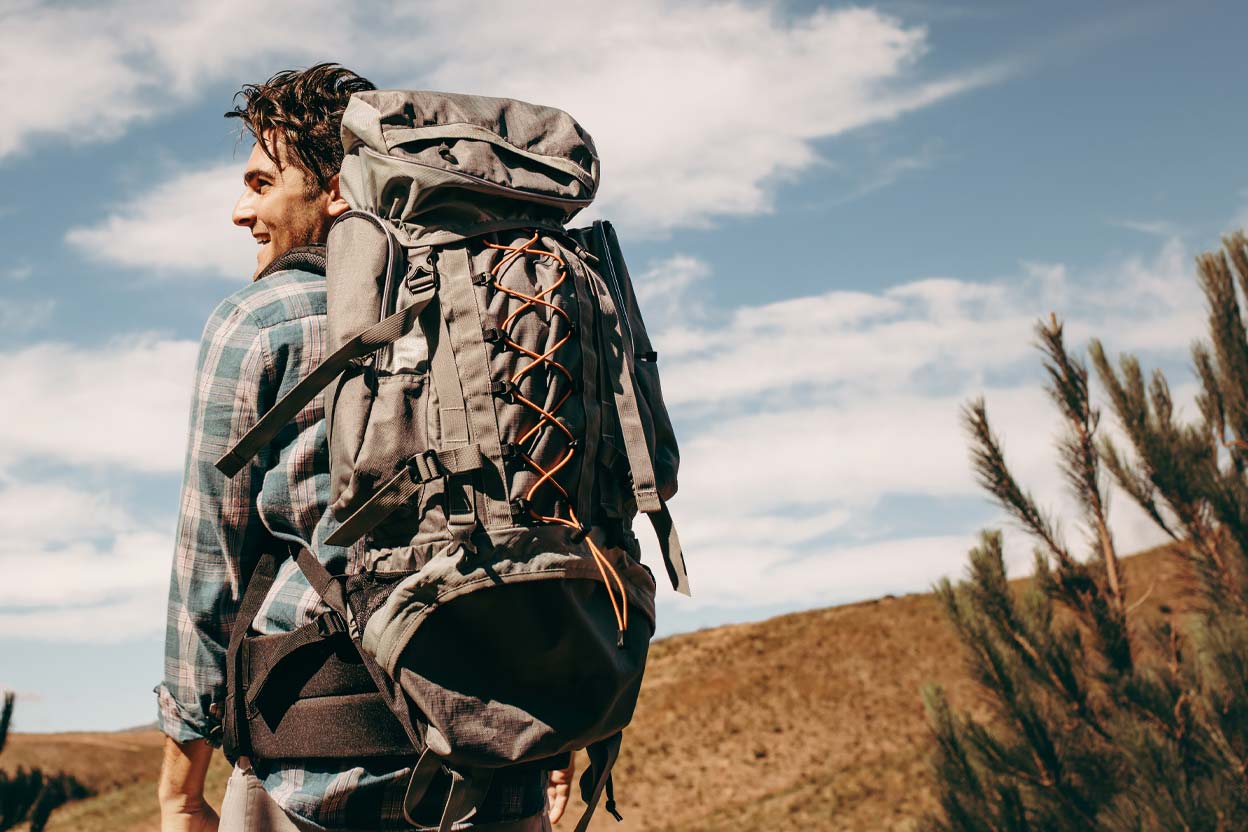 man hiking with backpack, Laser Eye Surgery Brisbane, Laser Eye Surgery Fortitude Valley