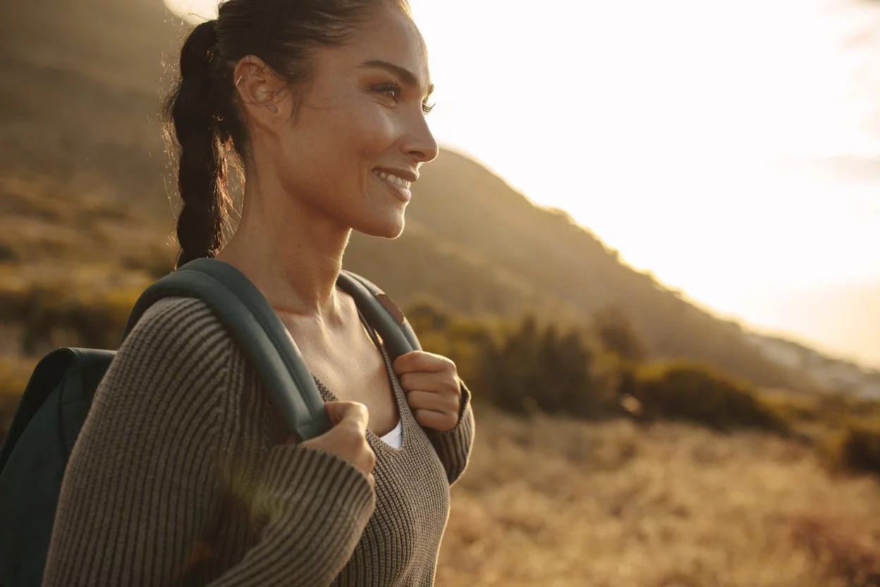 woman hiking with backpack in the mountains, Laser Eye Surgery Brisbane, Laser Eye Surgery Fortitude Valley